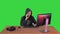 Experienced hacker answers someones call on a Green Screen, Chroma Key.