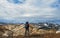 Experienced hiker woman with heavy huge backpack standing and looking at rhyolite mountains Landmannalaugar Iceland