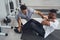 Experienced osteopath assessing male patient physical fitness