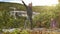 An experienced yoga instructor doing breathing exercises in the mountains