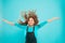 Experiencing a hair to balance your energy. Adorable girl curly hair waving on blue background. Small cute girl with