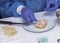 Expert analyzes stuffed meat contaminated by bacterium of listeria in laboratory