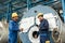 Expert checking the quality of manufactured boilers