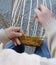 expert craftsman creates a handmade wicker basket