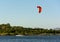 Expert Kitesurfer Planing with  Sea Watrer Splashes during Golden Hour