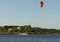 Expert Kitesurfer Planing with  Sea Watrer Splashes during Golden Hour