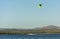 Expert Kitesurfer Planing with  Sea Watrer Splashes during Golden Hour