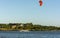 Expert Kitesurfer Planing with  Sea Watrer Splashes during Golden Hour