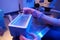Expert lab scientist freezing human embryos in cryogenic freezer box
