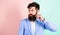 Expert tips for growing and maintaining moustache. Hipster handsome attractive guy with long beard. Man bearded hipster