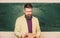 Explaining theory. College and high school. Prepare for test. Teacher bearded man hold documents chalkboard background