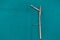 explanted femoral nail with locking screw lies on a green surgical drape