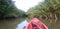 Exploration tour in a Tropical canal, canoe paddling in a river