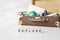 Explore: Adventure Travel Holidays. Travel, adventure, vacation concept. Word EXPLORE and Brown retro suitcase with traveler set o
