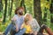 Explore nature together. Family day concept. Mom dad and kid boy relaxing while hiking in forest. Family picnic. Mother