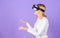 Explore virtual reality. Digital device and modern opportunities. Woman head mounted display violet background. Virtual