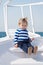 Explore world. Child cute sailor on yacht sunny day. Adventure of boy sailor travelling sea. Boy adorable sailor striped