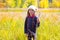Explorer binocuar kid girl in yellow autumn nature