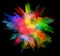 Explosion of colored powder on black background