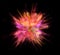 Explosion of coloured powder isolated on black background.