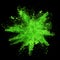 Explosion of green powder on black background