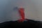 explosive eruption at dusk in one of the three craters of the active stromboli volcano