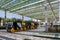 Expo 2020 Dubai - Expo Explorer yellow compressed air train carrying tourists through Expo site.