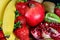 Exposition of fresh natural fruit, organic Strawberry, half of garnet, banana and kiwi, black background, healthy food,