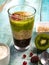 Exposition of fresh organic and nature smoothie. Tasty and healthy desert fresh fruits, kiwi, strawberry, vegetables and yogurt on