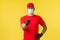 Express delivery during pandemic, covid-19, safe shipping, online shopping concept. Confident courier in red uniform