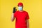 Express delivery during pandemic, covid-19, safe shipping, shopping concept. Courier in red uniform and medical mask