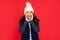 express positive emotion. winter fashion. amazed emotional kid with curly hair in hat