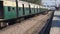 Express train moving forward during springtime under the beautiful cloudscape, indian railways train crossing through railways tra