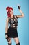 Expression. Glamorous Trendy Woman with red Hairs showing Victory Sign