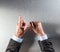 Expressive businessman hands counting, showing moderation or reflection at office