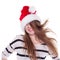 Expressive emotional girl in a Christmas hat on white background