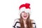 Expressive emotional girl in a Christmas hat on white background