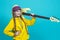 Expressive Positive Caucasian Teenager Guitar Player With Yellow Bass Guitar Posing In Fashionable Yellow Hoody Jacket With