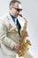 Expressive Stylish Caucasian Saxophone Player Performing in Whit