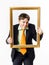 Expressive teenage boy posing with picture frame