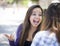 Expressive Young Mixed Race Female Sitting and Talking with Girl