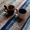 Expresso cups on colorful background. Coffee cups on handmade carpet