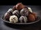 Exquisite Dark Chocolate Dessert with Berries and MintAn array of Tempting Dark Chocolate Truffles