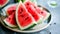 Exquisite Display: Vibrant Watermelon Slices With Dotted Black Seeds -