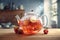 Exquisite glass teapot with tea leaves, lemon slices and ice cubes stands on wooden table. Steaming transparent teapot with