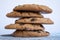 Exquisite homemade chocolate chip cookies stacked on a table and with white background