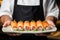 Exquisite Japanese cuisine: a chef\\\'s skilled hands showcase sushi rolls