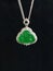 Exquisite pendant from sterling silver and set with an antique jade and diamond Buddha figure