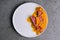 Exquisite serving juicy duck tenderloin with carrot puree