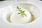 Exquisite Serving Restaurant Plate of White Parmesan Sphere with Black Angus Tartare Top View